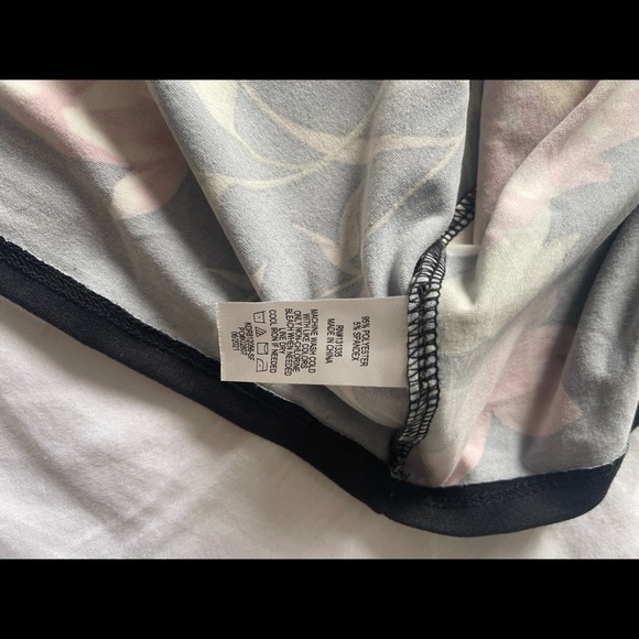 Never worn, floral, below the knee, asymmetrical faux wrap dress with tags. - Picture 4 of 4